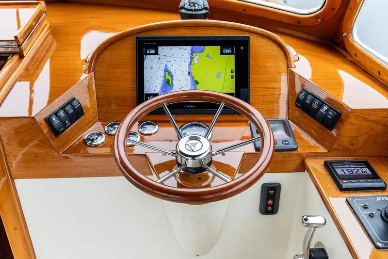 Slide: The Image of Steering wheel and navigation system of a 1998 Hinckley Picnic Boat. - 27