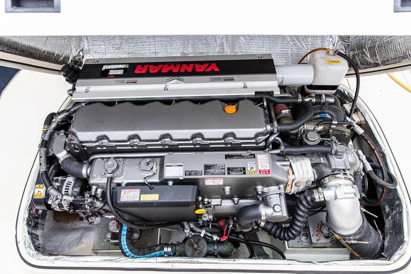 Slide: The Image of Engine of a 1998 Hinckley Picnic Boat, featuring a Yanmar diesel engine. - 47