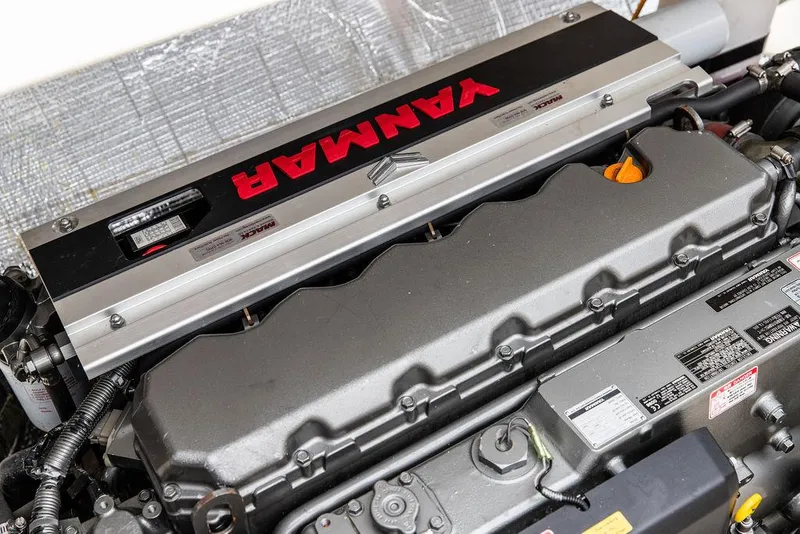 Slide: The Image of Engine of a 1998 Hinckley Picnic Boat featuring a Yanmar diesel engine. - 48