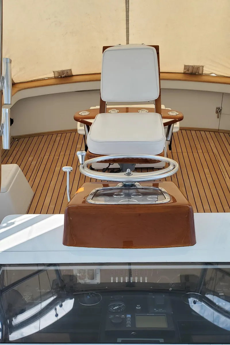 Slide: The Image of 1985 Rybovich 32 Express Walkaround Sportfish with teak deck and captain's chair. - 15