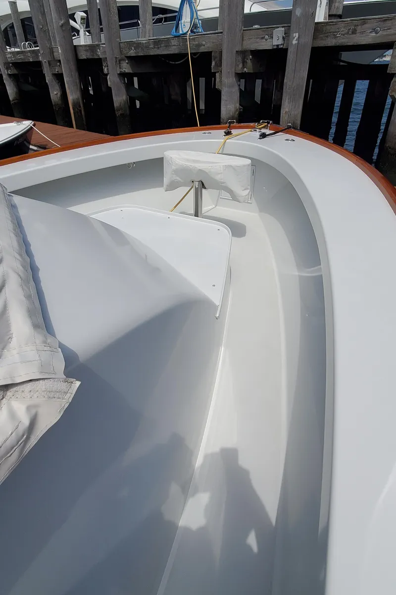 Slide: The Image of 1985 Rybovich 32 Express Walkaround Sportfish boat deck near dock. - 16