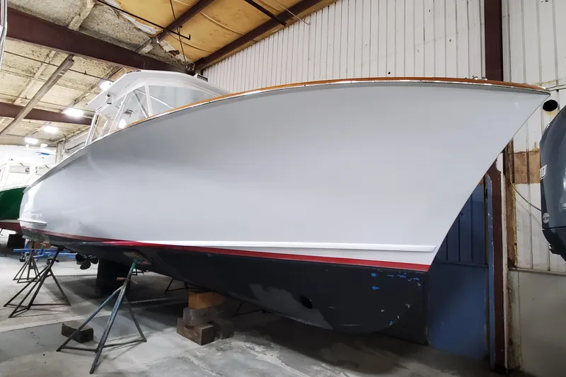 Slide: The Image of 1985 Rybovich 32 Express Walkaround Sportfish in a boatyard, side view. - 23