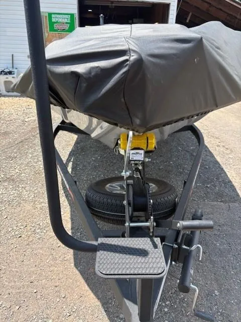 Slide: The Image of 2024 Tracker Pro Team 195 TXW Tournament Edition boat on trailer, covered and secured. - 14