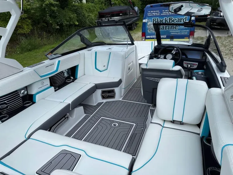 Slide: The Image of 2020 Nautique Super Air Nautique G21 interior with sleek seating and modern dashboard. - 10