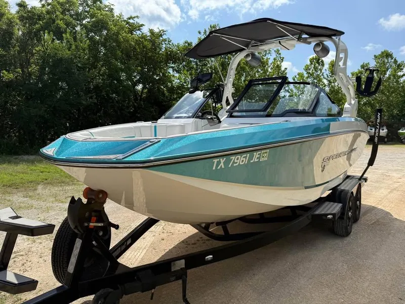 Slide: The Image of 2020 Nautique Super Air Nautique G21 boat on trailer, parked outdoors. - 3