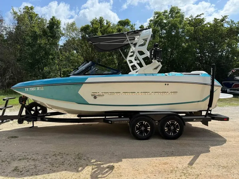 Slide: The Image of 2020 Nautique Super Air Nautique G21 boat on trailer, parked outdoors. - 4