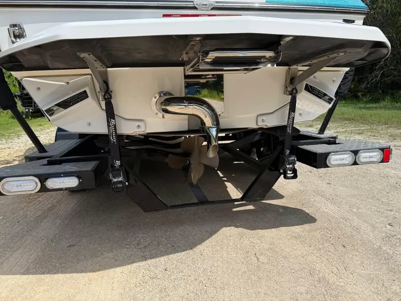 Slide: The Image of 2020 Nautique Super Air Nautique G21 boat rear view with propeller and exhaust system. - 5