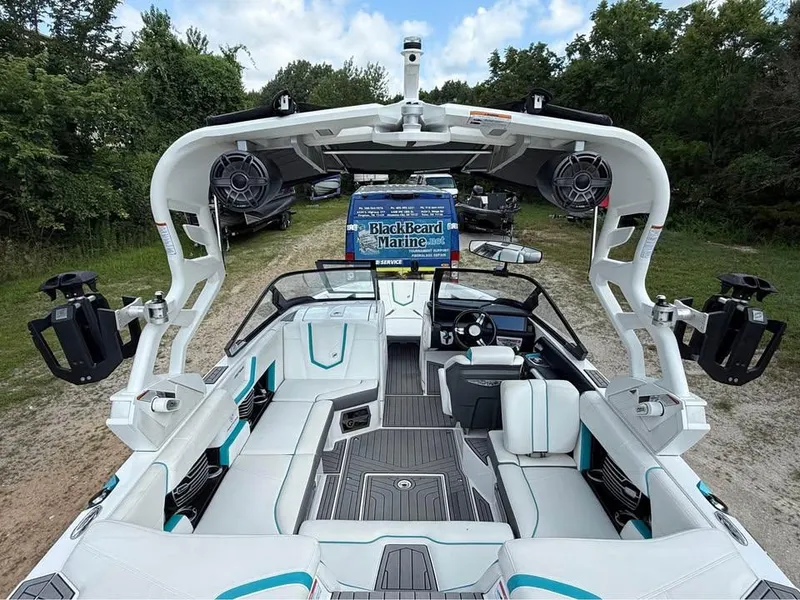 Slide: The Image of 2020 Nautique Super Air Nautique G21 boat interior with advanced sound system and seating. - 8