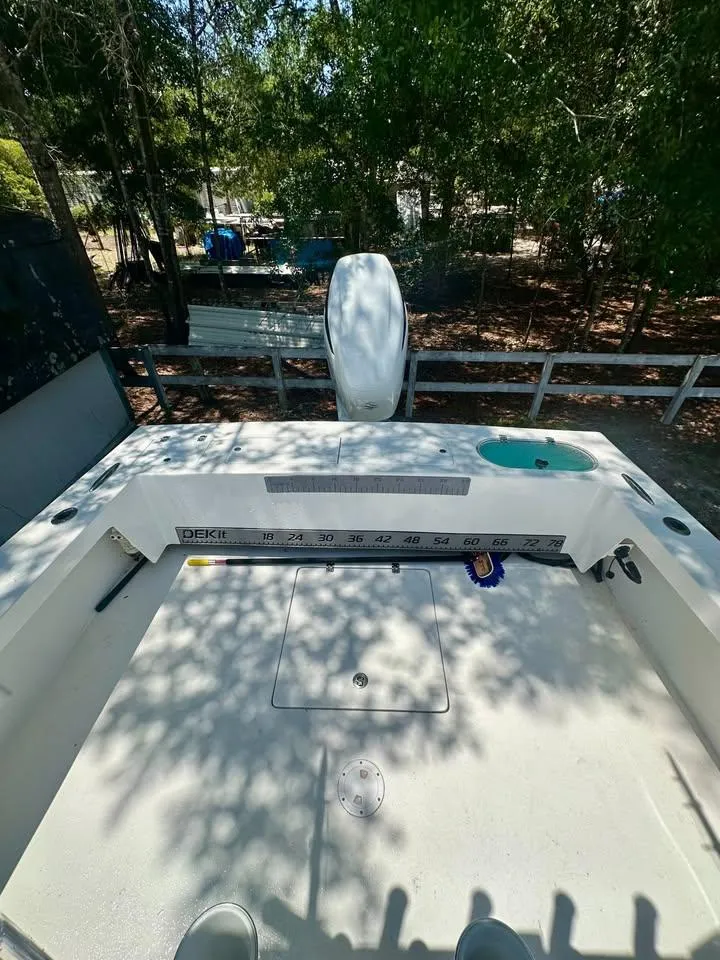 Slide: The Image of Southern Cross 25 boat deck, 2022 model, with measuring ruler and storage hatch. - 10