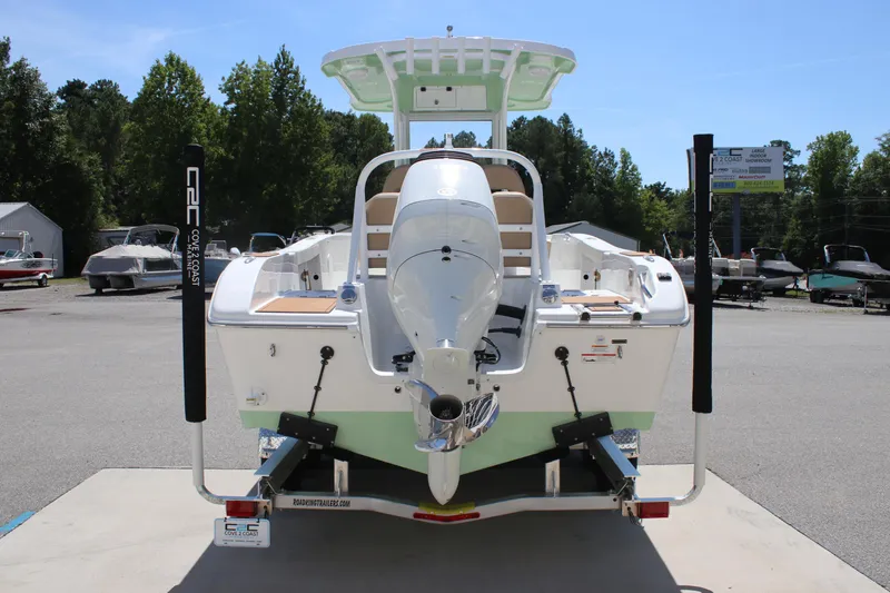 Slide: The Image of 2026 Sea Pro 245 Sandbar boat on trailer, rear view, outdoors. - 17