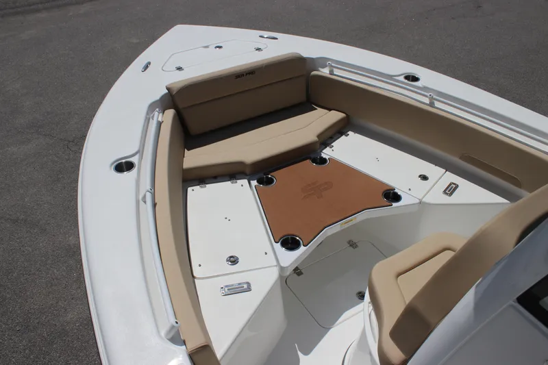 Slide: The Image of 2026 Sea Pro 245 Sandbar boat interior with tan seating and white deck. - 18