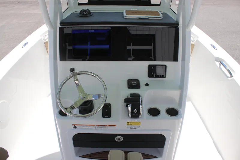 Slide: The Image of 2026 Sea Pro 245 Sandbar boat console with steering wheel and controls. - 23