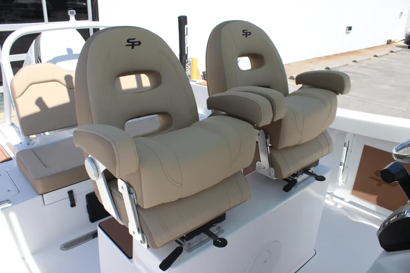 Slide: The Image of 2026 Sea Pro 245 Sandbar boat seats, beige upholstery, ergonomic design, armrests, and adjustable features. - 25