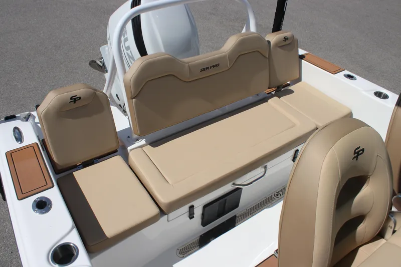 Slide: The Image of 2026 Sea Pro 245 Sandbar boat interior with tan seating and storage compartments. - 39