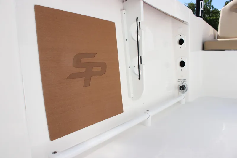 Slide: The Image of 2026 Sea Pro 245 Sandbar boat interior with logo and utility features. - 49