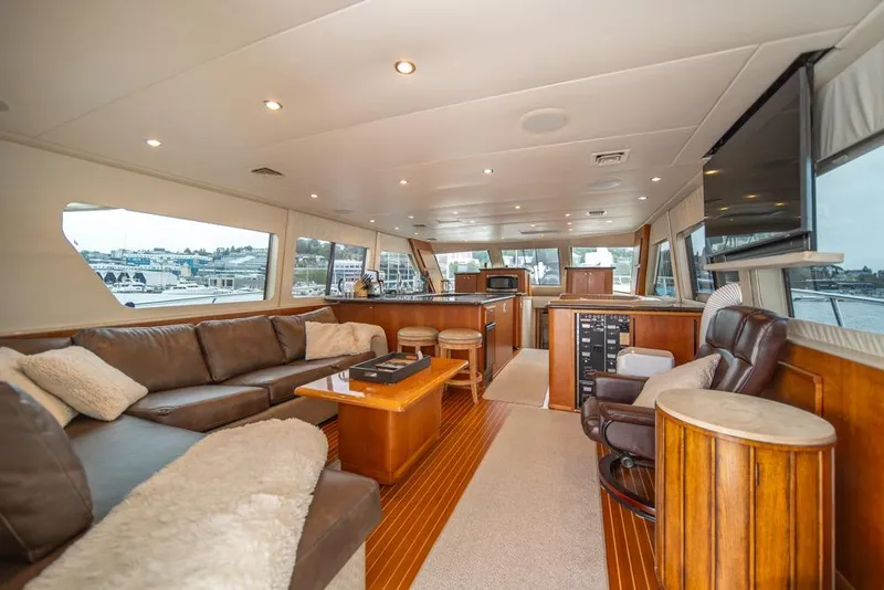 Slide: The Image of Luxurious interior of 1988 Hatteras 65 Sportfish yacht with leather seating and wood accents. - 17