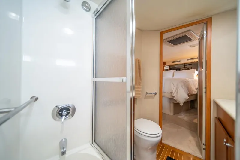 Slide: The Image of Bathroom and bedroom interior of 1988 Hatteras 65 Sportfish yacht. - 27