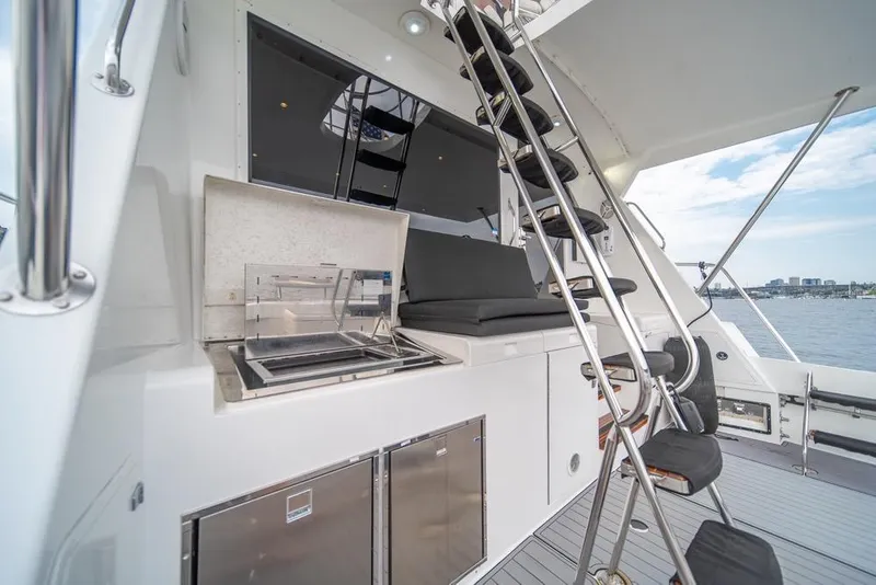 Slide: The Image of 1988 Hatteras 65 Sportfish yacht interior with modern amenities and sleek design. - 40