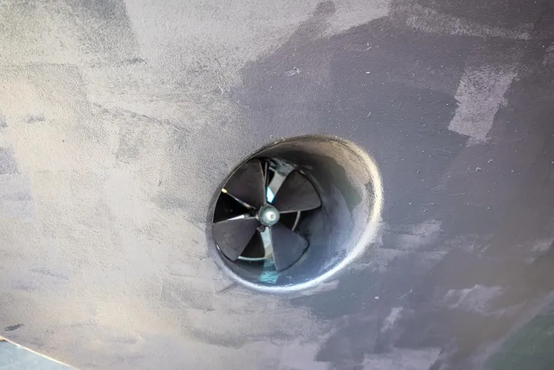 Slide: The Image of Bow thruster on a 1988 Hatteras 65 Sportfish yacht hull. - 60