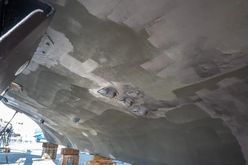 Slide: The Image of Underside view of 1988 Hatteras 65 Sportfish boat hull on dry dock. - 66