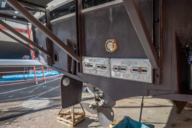 Slide: The Image of 1988 Hatteras 65 Sportfish boat hull with visible zinc anodes and propeller. - 70