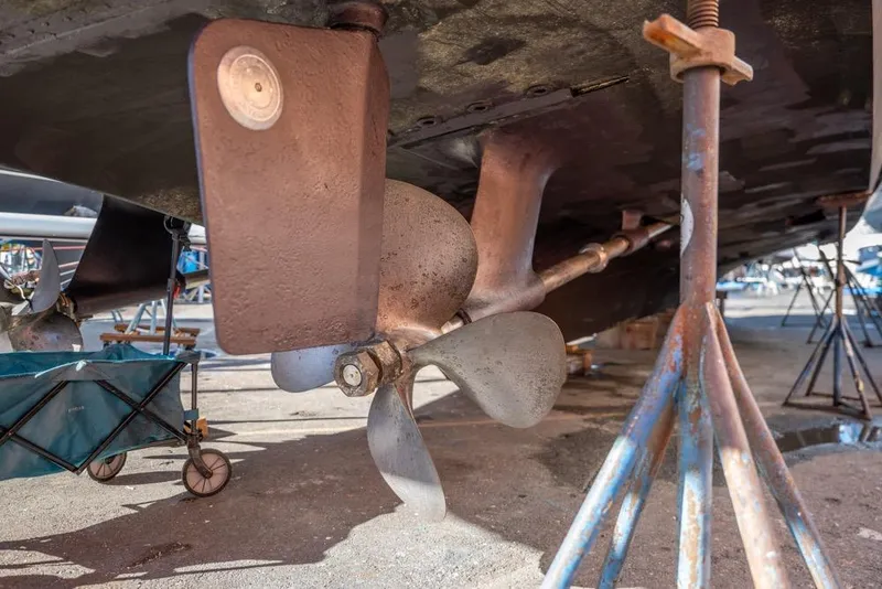 Slide: The Image of Underside view of 1988 Hatteras 65 Sportfish boat with propeller and rudder. - 71