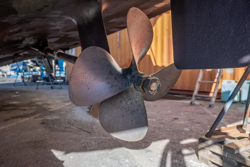 Slide: The Image of Propeller of 1988 Hatteras 65 Sportfish boat in dry dock. - 75