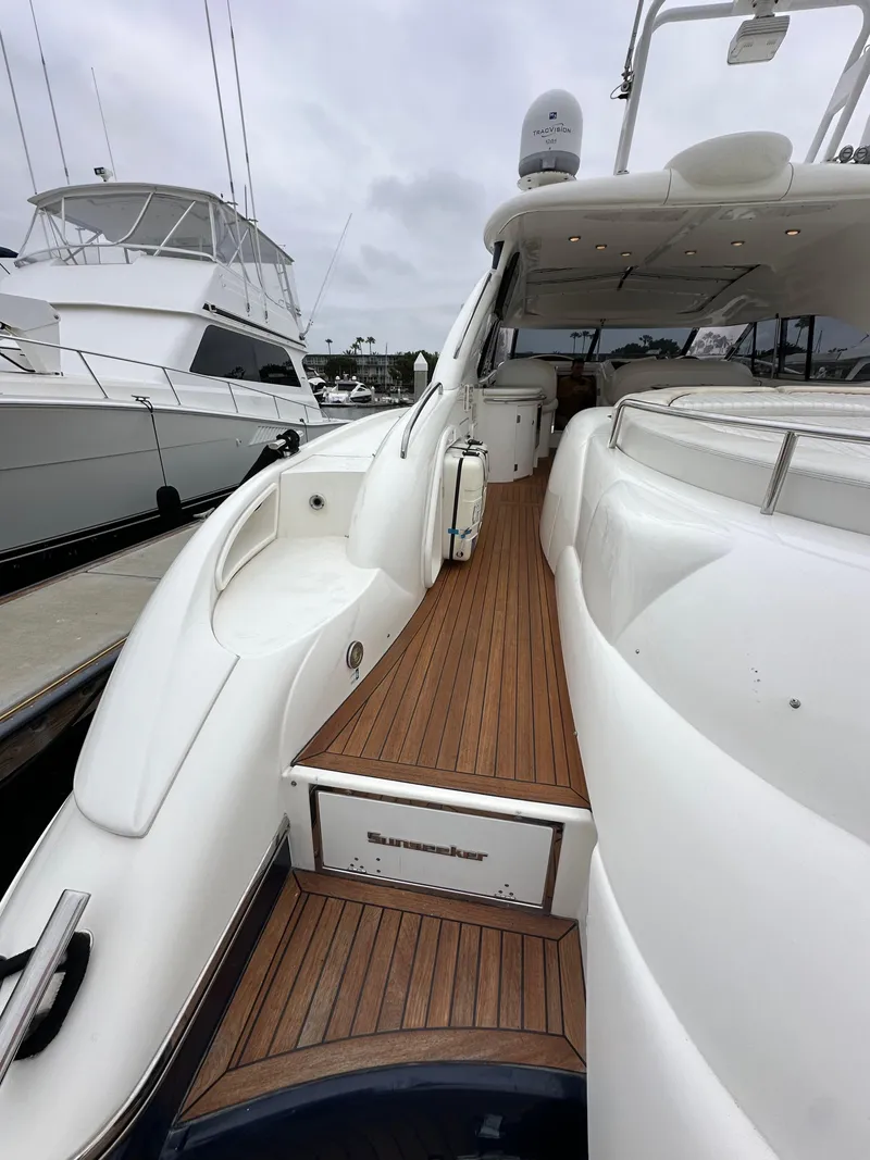 Slide: The Image of 2000 Sunseeker Predator 60 yacht with sleek deck design and luxurious features. - 11