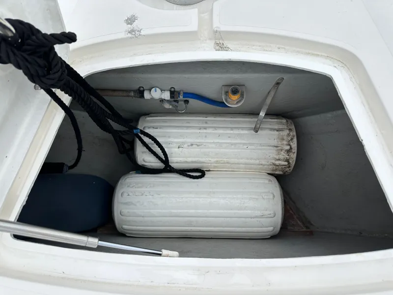 Slide: The Image of Storage compartment of 2000 Sunseeker Predator 60 with fenders and ropes. - 21
