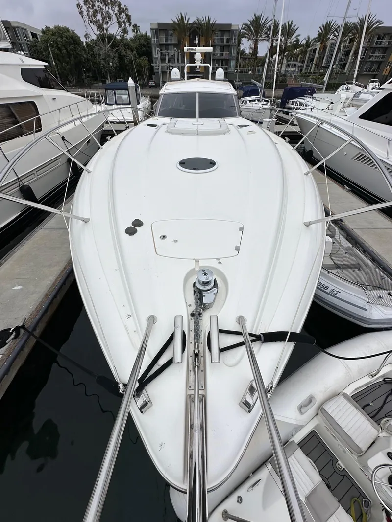 Slide: The Image of Sunseeker Predator 60 yacht, 2000 model, docked at marina with other boats. - 22