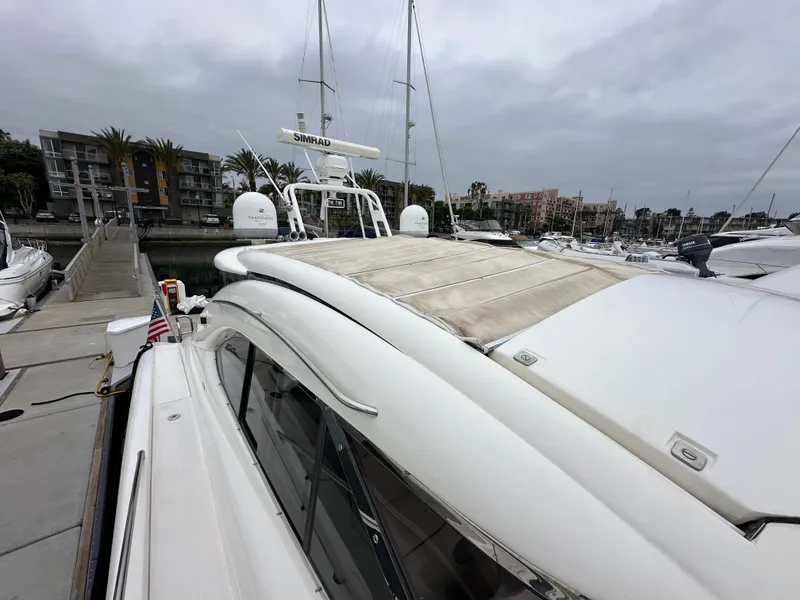 Slide: The Image of Sunseeker Predator 60 yacht docked at marina, overcast sky, 2000 model. - 25