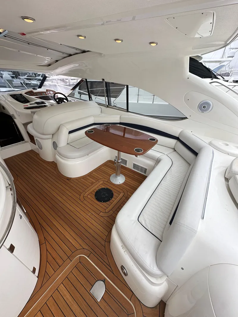 Slide: The Image of Luxurious interior of 2000 Sunseeker Predator 60 yacht with elegant seating and wooden flooring. - 33