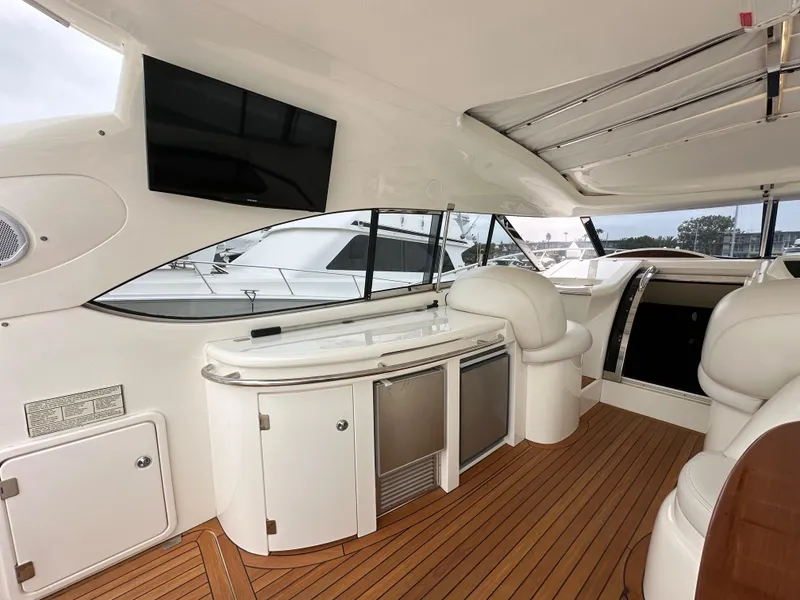 Slide: The Image of Interior of 2000 Sunseeker Predator 60 yacht with sleek design and wooden flooring. - 34