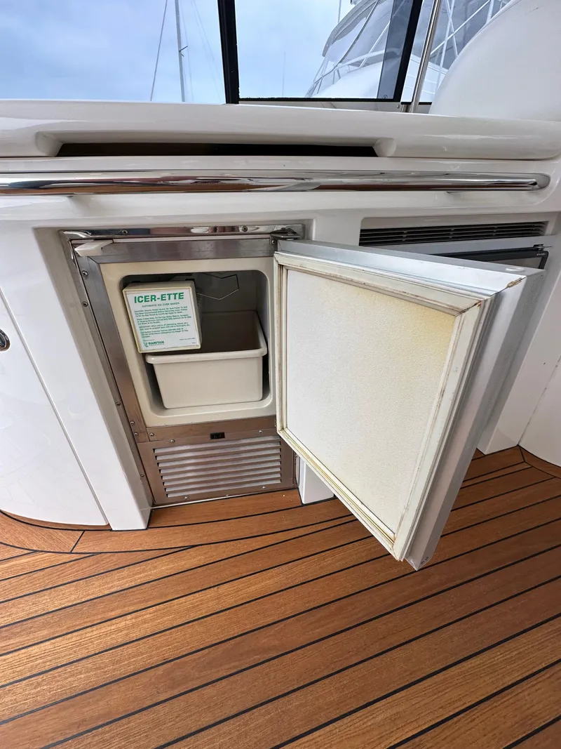 Slide: The Image of Open ice maker on 2000 Sunseeker Predator 60 yacht with teak flooring. - 35