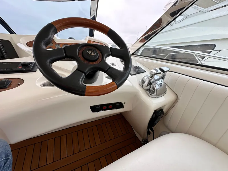Slide: The Image of Steering wheel and controls of a 2000 Sunseeker Predator 60 yacht. - 44