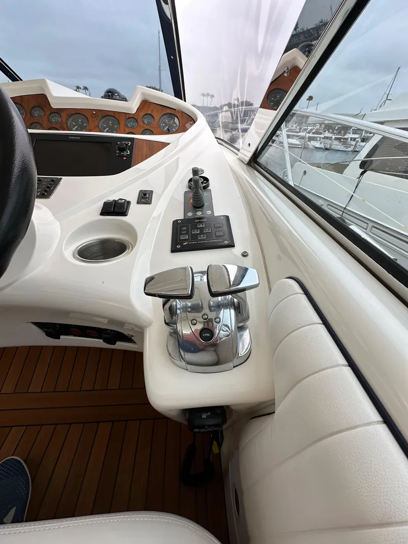 Slide: The Image of Sunseeker Predator 60 yacht cockpit controls, 2000 model, featuring sleek design and modern instrumentation. - 45