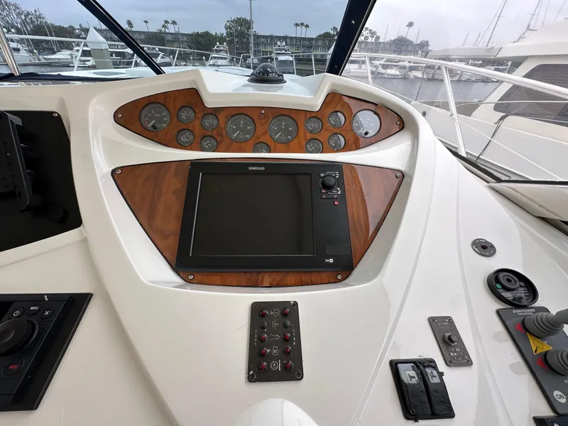 Slide: The Image of Cockpit of 2000 Sunseeker Predator 60 yacht with navigation controls and gauges. - 46