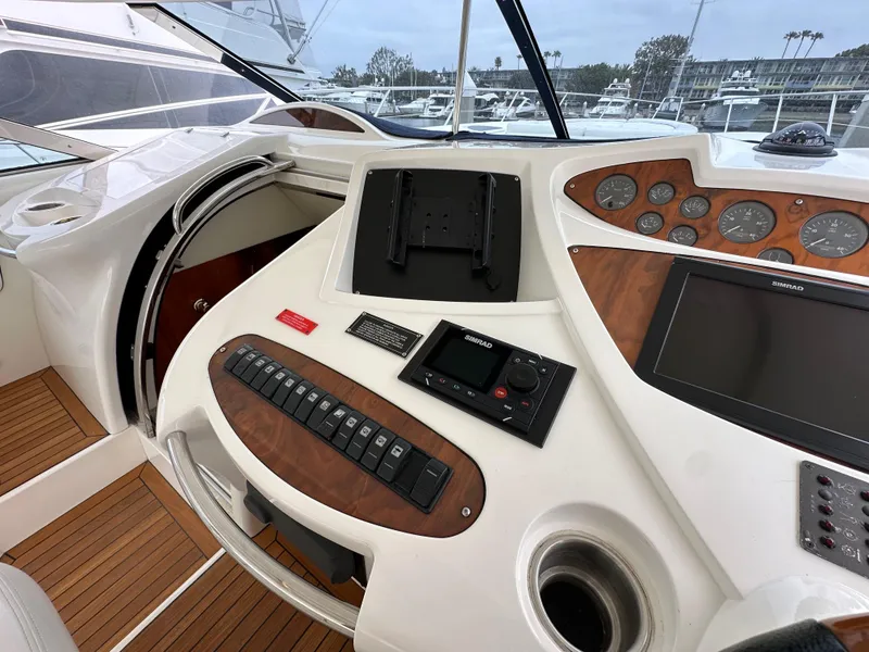 Slide: The Image of Cockpit of 2000 Sunseeker Predator 60 yacht with control panel and navigation instruments. - 47