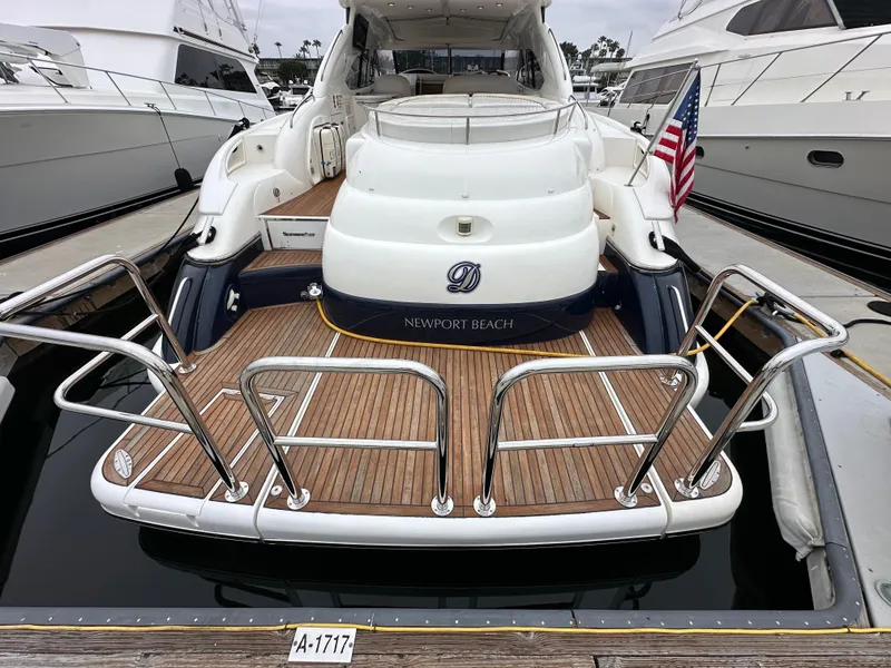 Slide: The Image of Sunseeker Predator 60 yacht, 2000 model, docked with American flag, Newport Beach. - 8