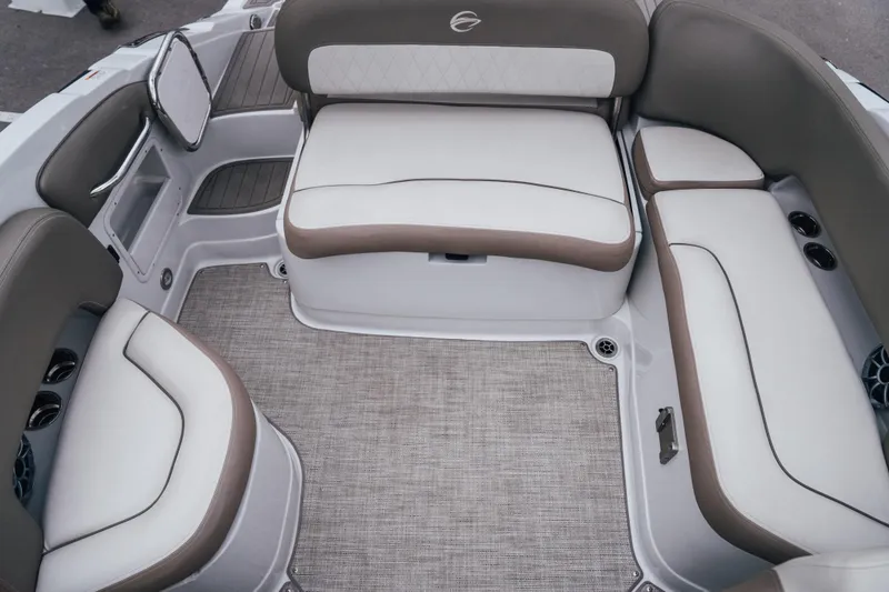 Slide: The Image of 2023 Crownline Eclipse E235 boat interior with plush seating and modern design. - 30
