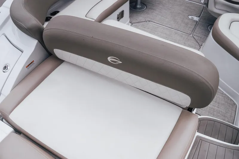 Slide: The Image of 2023 Crownline Eclipse E235 boat interior seating with beige and white upholstery. - 31
