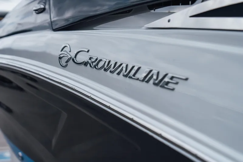 Slide: The Image of 2023 Crownline Eclipse E235 boat side view with logo detail. - 33