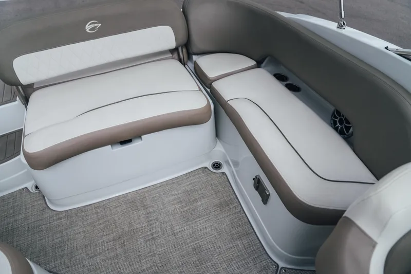 Slide: The Image of 2023 Crownline Eclipse E235 boat interior with beige and white cushioned seating. - 36