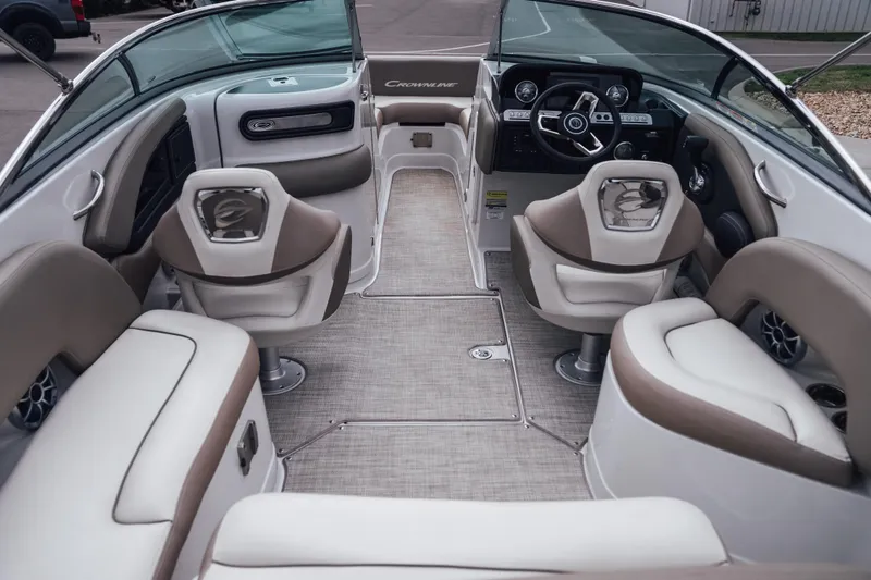 Slide: The Image of 2023 Crownline Eclipse E235 boat interior with luxurious seating and modern dashboard. - 39