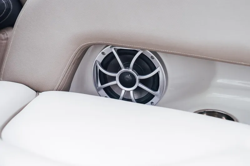 Slide: The Image of 2023 Crownline Eclipse E235 boat speaker detail with beige upholstery. - 43