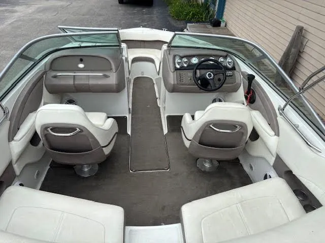 Slide: The Image of Interior of a 2005 Cobalt 200 boat with seating and dashboard view. - 11