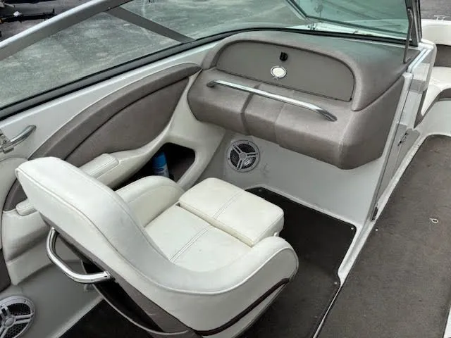 Slide: The Image of 2005 Cobalt 200 boat interior with white seating and dashboard. - 12
