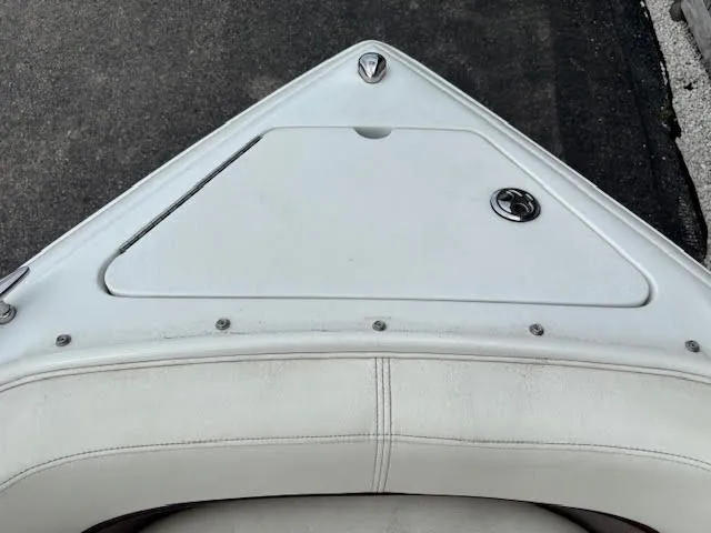 Slide: The Image of Bow of a 2005 Cobalt 200 boat with white seating and storage compartment. - 16