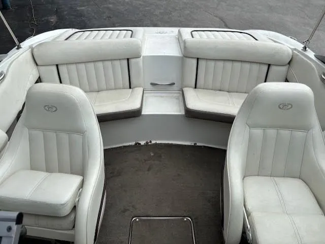 Slide: The Image of Interior of a 2005 Cobalt 200 boat with white leather seating. - 18