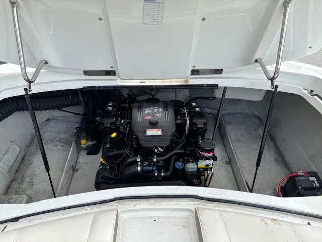 Slide: The Image of Engine compartment of a 2005 Cobalt 200 boat, showcasing the motor and components. - 22